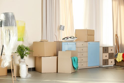 Moving team handling items near a terrace street with limited access