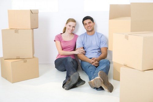 Packing boxes beside a UK removal van