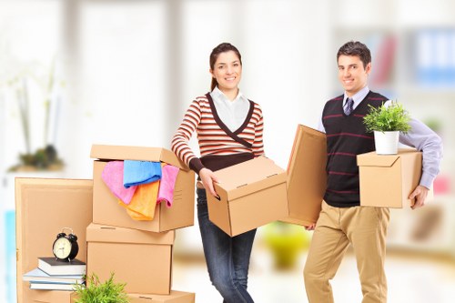 Estimator reviewing load size and cubic-yard pricing for a house move