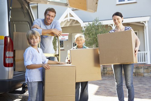 House removalists loading belongings into a moving van in the UK