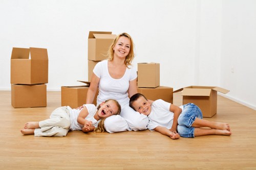 Packed boxes and moving supplies for a UK flat relocation