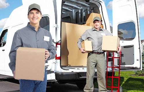 House moving boxes labeled for room-by-room packing in the UK