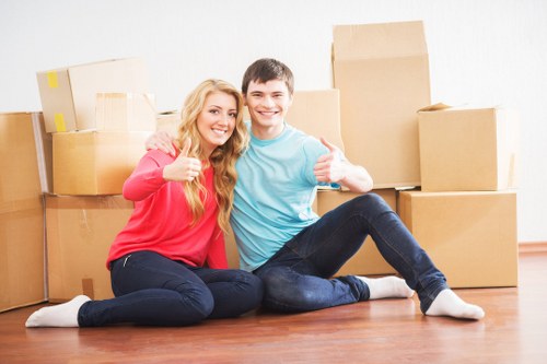 Medium moving truck loaded with household boxes