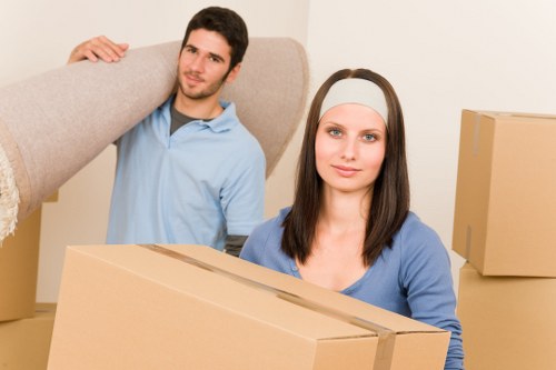 Removal team handling furniture during a UK home relocation